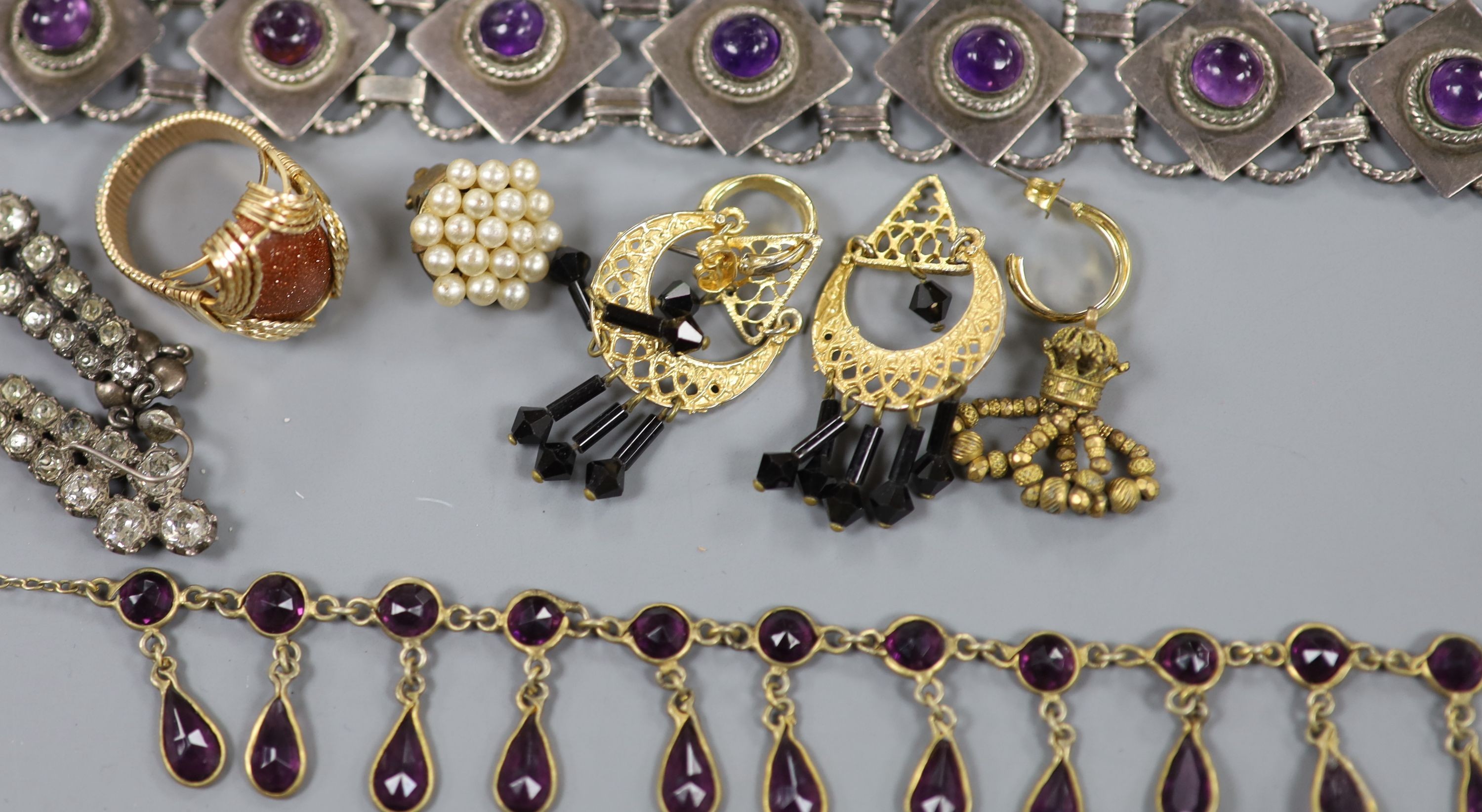Mixed jewellery including two gilt white metal masonic ball pendants, 14k white metal, diamond and cultured pearl set floral spray brooch, 57mm, gross 11.3 grams and a cabochon amethyst set bracelet.